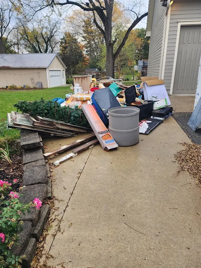 Dumpster being loaded with debris for 3 Yard Dumpster Rental in Orchidlands Estates
